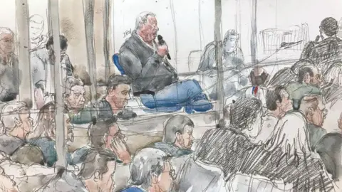 Benoit PEYRUCQ/AFP A court sketch shows Dominique Pelicot giving evidence in court during the trial in Avignon