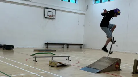 Action shot of Theo skateboarding 