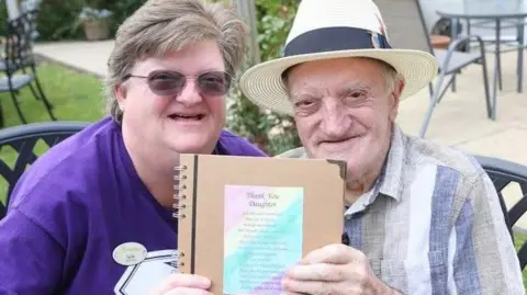 Joe Miechielsens and daughter Julie with the handwritten letter