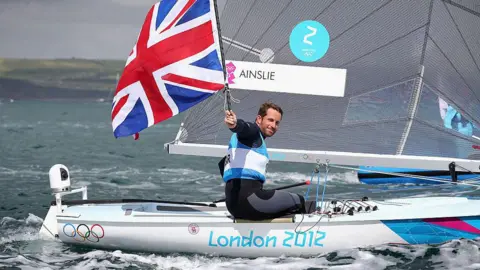 Getty Images Ben Ainslie of Great Britain celebrates overall victory after competing in the Men's Finn Sailing Medal Race on Day 9 of the London 2012 Olympic Games at the Weymouth & Portland Venue at Weymouth Harbour on August 5, 2012 in Weymouth, England.