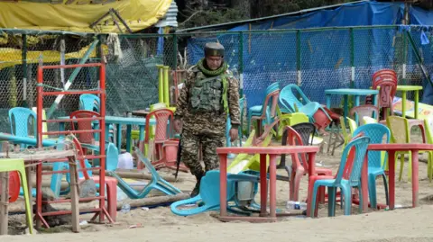 Reuters Gunmen shot dead 26 people, mostly tourists, in Indian-administered Kashmir's Pahalgam in April. The photograph shows a soldier patrolling the location of the killings.