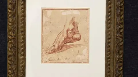 Christie's A framed drawing of an arched foot, in what appears to be red pencil.