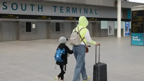 Getty Images Passengers arriving at Gatwick Airport's South Terminal