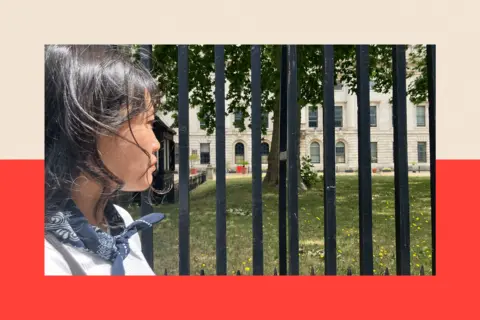 Carmen turns side profile to the camera