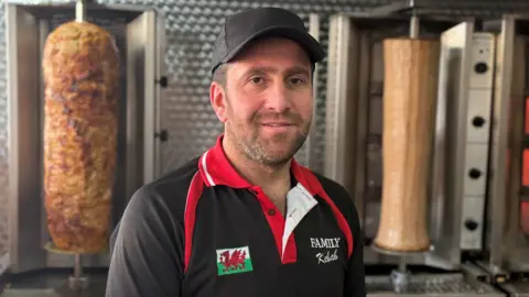 A man in a kebab shop 