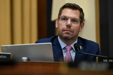 Reuters U.S. Representative Eric Swalwell wears a navy suit and transluscent-framed spectacles as he attends a House Judiciary Committee hearing