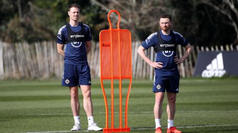Jonny and Corry Evans in training