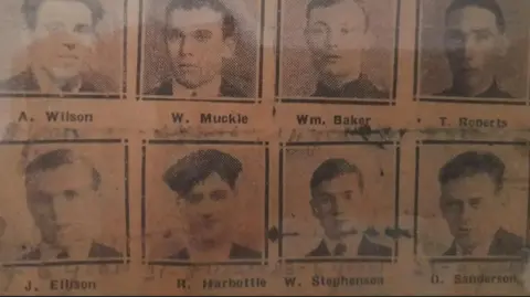 A newspaper cutting of the head and shoulders of a eight men sent to prison over the derailment. The shots are grainy but they are all smartly dressed 