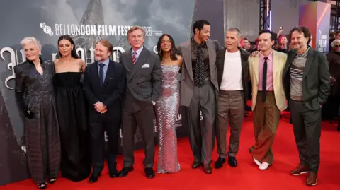 EPA/Shutterstock Glenn Close, Mila Kunis, Rian Johnson, Daniel Craig, Kerry Washington, Daryl McCormack, Josh Brolin, Andrew Scott and Ram Bergman pose on the red carpet at the premiere of the film 'Wake Up Dead Man: A Knives Out Story' during the opening night gala of the BFI London Film Festival, in London, Britain, 08 October 2025.