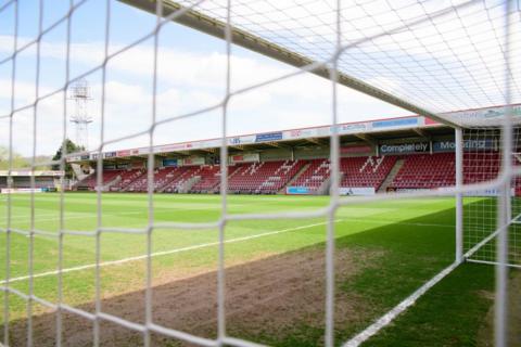 View through a football net at Cheltenham FC stadium