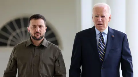 EPA Zelensky and Biden walk through the White House.