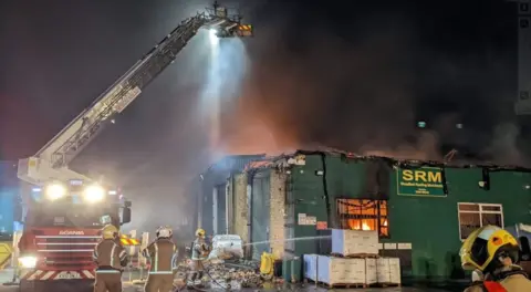 Firefighters tackling blaze in storage unit