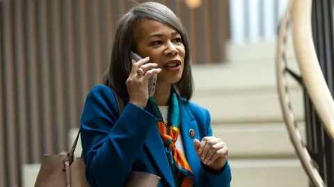 Getty Images Lisa Blunt Rochester on the phone