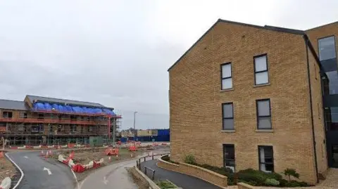 Google An apartment block being built on a new estate