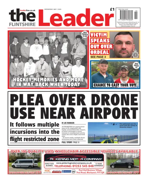 Flintshire Leader Front page of the Flintshire Leader has a picture of a police man next to his police car looking at a drone flying over a blue wire fence at Hawarden Airport. The headline reads: "Plea over drone use near airport." 