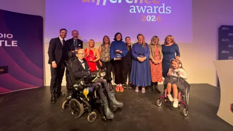 BBC Matt Bailey and Anna Foster with the award winners on stage at the Baltic in Gateshead.
