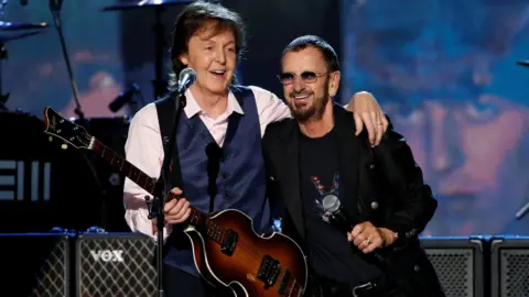 Reuters Sir Paul McCartney (left) and Sir Ringo Starr (file image)