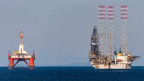 Several oil rigs stacked up in the Cromarty Firth