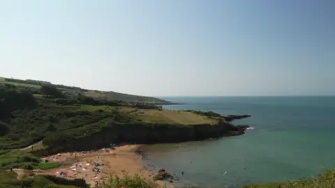 A view of a beach and the sea