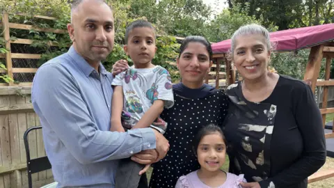 Idrees at home with his dad Qasim, mum Sadia, sister Eliza and grandma Nasreen