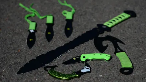 PA Media Examples of zombie knives lying on the floor