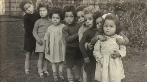 Shepton Mallet Prison A black and white photograph of a line of eight children looking at the camera