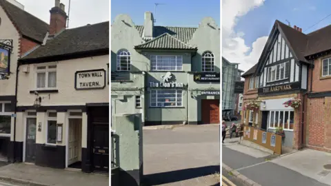 The Town Wall Tavern is a White building with black woodwork. The name of the pub is on a large plaque over the main entrance. The Lion's Inn is a a large building with a car park in front of it. It's painted in a light grey-green colour. The Aardvark is a brick-built pub with a black and white mock Tudor effect frontage.