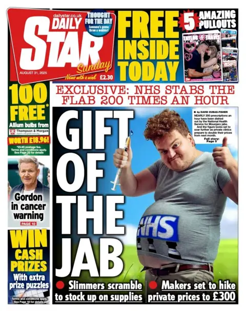 "Gift of the jab" reads the Daily Star's headline alongside a picture of an overweight man wearing an NHS t-shirt holding a needle. 
