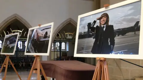 Guildford Cathedral service with images of those who died in the crash