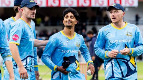 Jafar Chohan is congratulated by Yorkshire team-mates