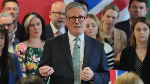Sir Keir Starmer giving a campaign speech in Chesterfield, Derbyshire, during the local elections in April, with Labour activists in the background. 