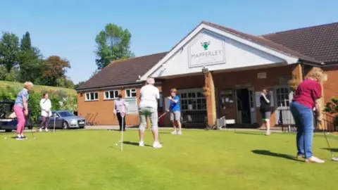 Mapperley Golf Club Group of golfers with puts outside Mapperley Golf Club on a sunny day 
