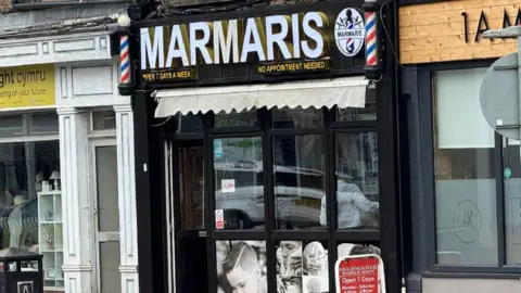 Shop front of a barber shop in Caerphilly County, south Wales. Marnaris barber shop was the scene of a mass brawl involving several men who were fighting over plans to open a new barber shop in nearby Newbridge.