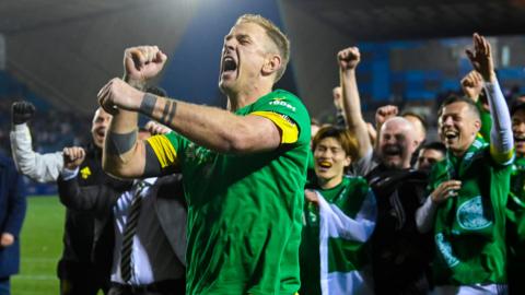 Celtic players and staff celebrate their title win at Rugby Park