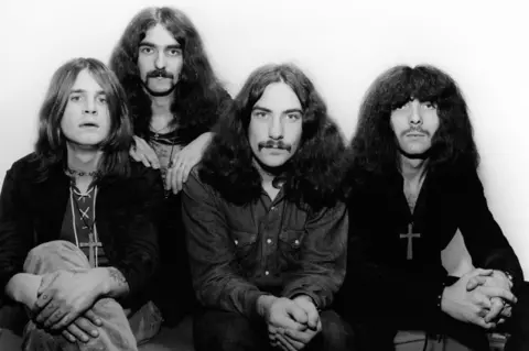A black and white image of Black Sabbath in the 1960s with Ozzy Osbourne, Bill Ward, Geezer Butler and Tony Iomi. 