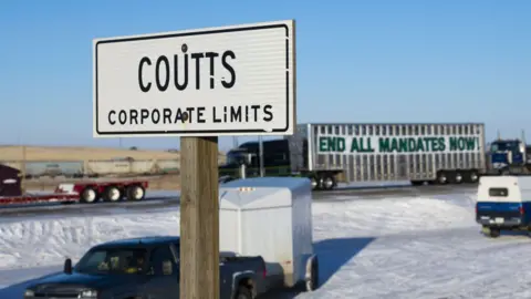 A slogan banner displayed on a truck blocking the US-Canada border during a demonstration in Coutts, Alberta, Canada, on Wednesday, Feb 2, 2022