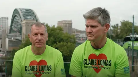Stuart Hall and Dan Spincer saw talking to the BBC wearing t-shirts that read 'Claire Lomas, inspiring forever' 