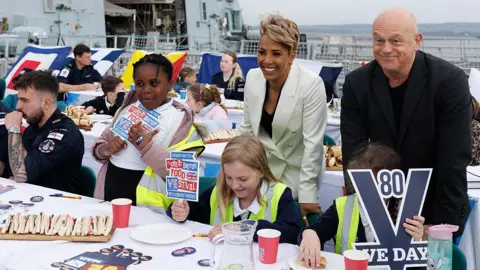 Getty Images Ross Kemp and Dame Kelly Holmes join school children and junior cadets during a 'street party' onboard the Royal Navy warship HMS Duncan at HM Naval Base on April 04, 2025 in Portsmouth