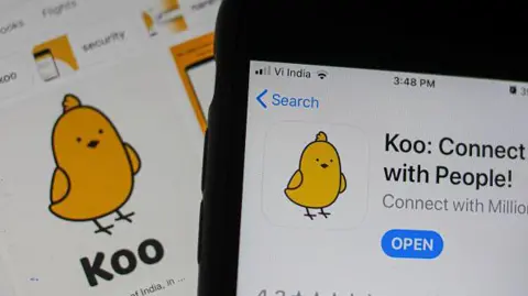 The Koo app arranged on a smartphone and tablet in Mumbai, India, on Wednesday, April 6, 2022. 