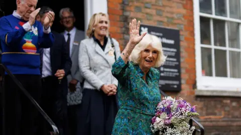  EPA-EFE/REX/Shutterstock Queen Camilla waving as she leaves Lamb House