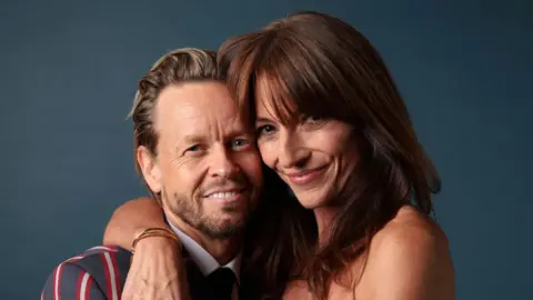 Getty Images Michael Douglas and Davina McCall pose together.