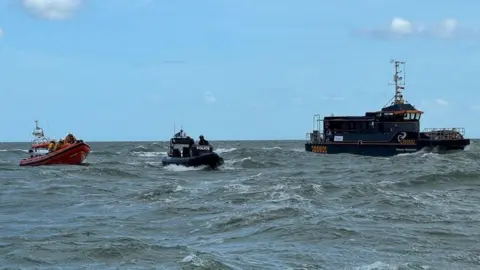 Essex Police The Burnham on Crouch lifeboat, the Essex Police rib Sentinel and the Gunfleet Sands crew transfer vessel