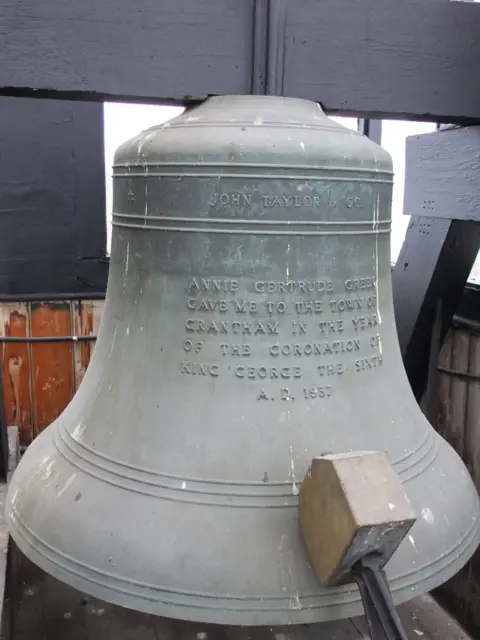 South Kesteven District Council A large bell with has an engraved text dedication to the coronation of King George VI.