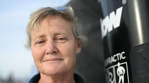 Getty Images Pip Hare poses for a photograph aboard her Imoca monohull 