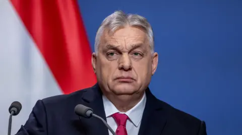 Viktor Orban, Hungary's prime minister, delivers a speech in January. He has short, grey hair and is wearing a shirt, suit and tie.
