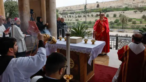 EPA Cardinal Pierbattista Pizzaballa (R), the Latin Patriarch of Jerusalem, holds a prayer service to mark Palm Sunday, in Jerusalem 