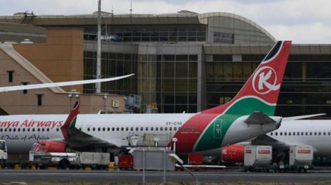This photograph taken on November 5, 2022, shows Kenya Airways planes at the parking bay amid a strike by pilots organised by Kenya Airline Pilots Association (KALPA), at the Jomo Kenyatta International airport in Nairobi. 