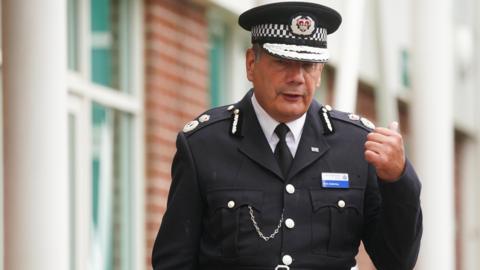 Nick Adderley, in his police uniform, pictured leaving the misconduct hearing