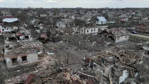 Reuters View of the town of Korosten in Zhytomyr region shows several rows of houses damaged in a missile strike