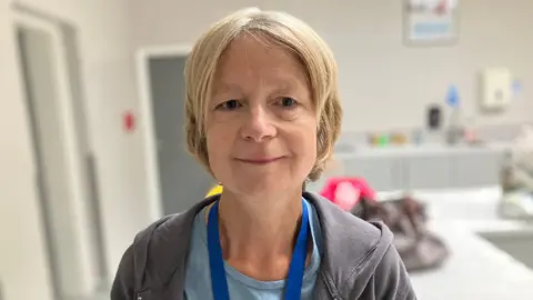 BBC Charity coordinator Chris Fox in the kitchen of a village hall after a session of indoor curling